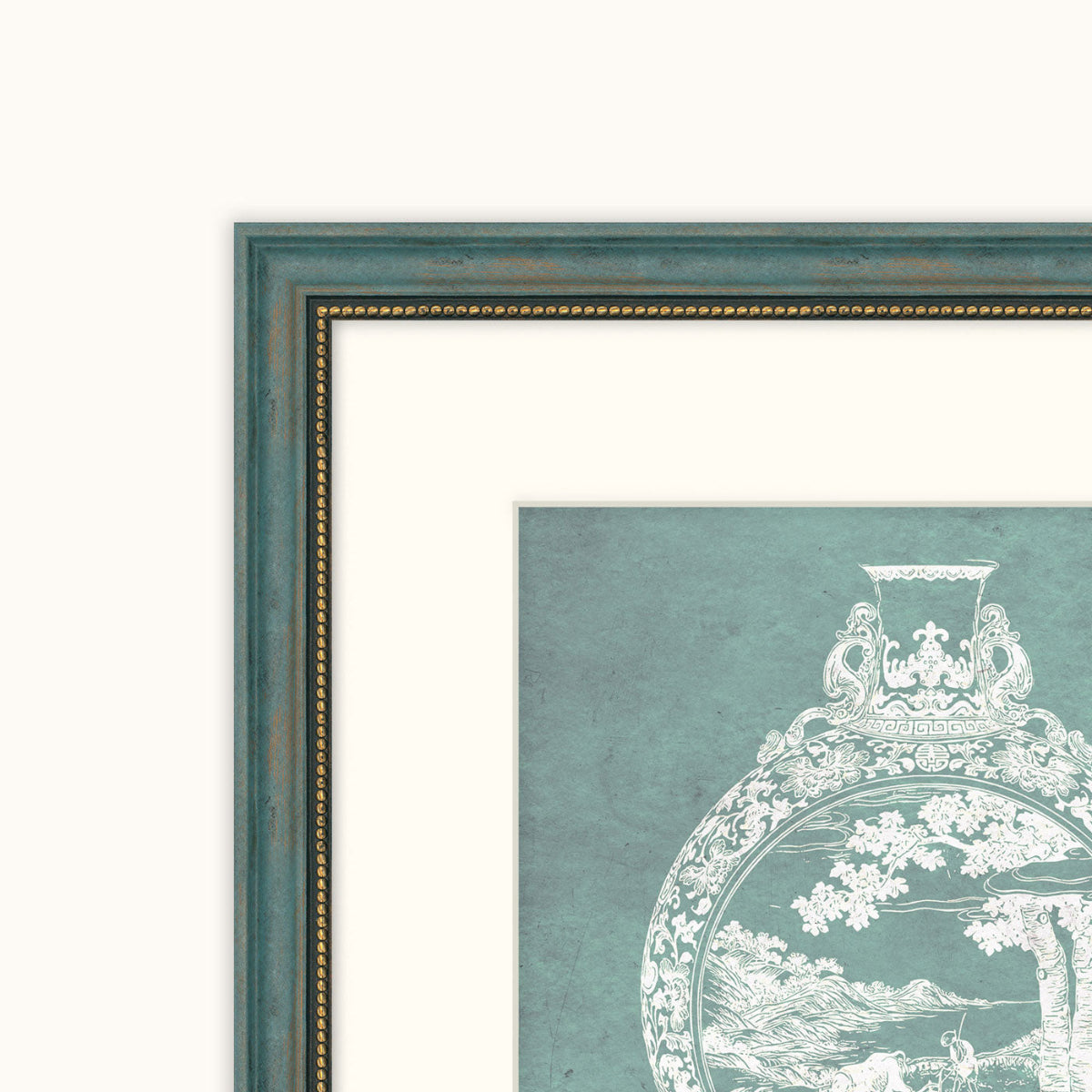 Close-up of a framed art showing a distressed teal-green frame with gold beading, white matting, and a white classical-style illustration on a muted teal background.