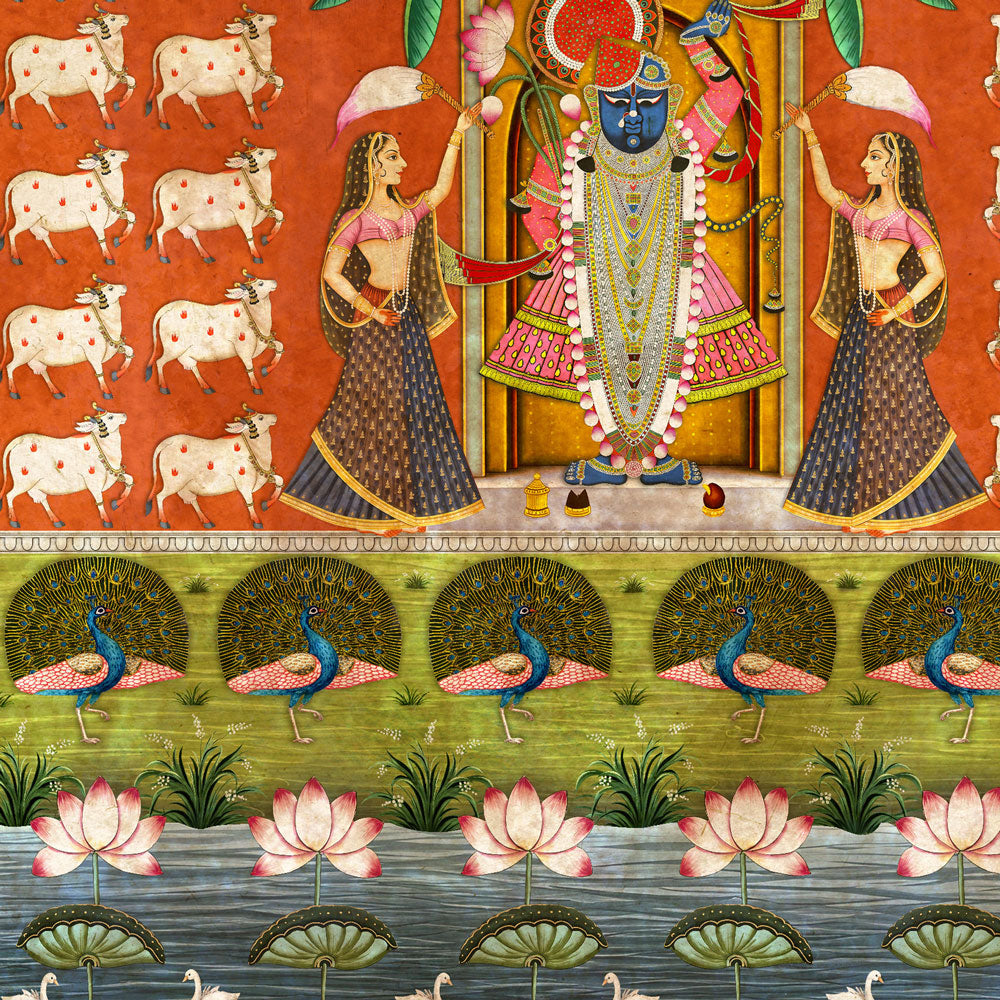 A traditional Indian-style textile or wallpaper pattern featuring a central blue-skinned deity in ornate gold and pink attire, flanked by two dancing women with pink and white umbrellas. The left side shows a repeating row of white cows with pink spots on a rust-orange background.
