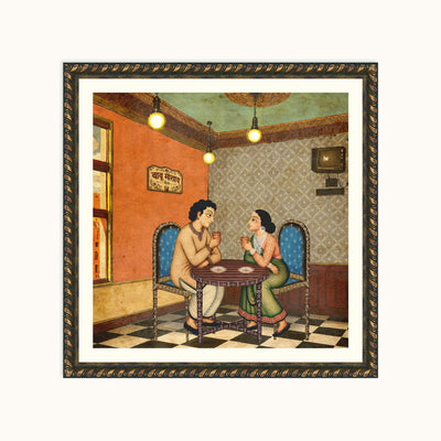 A framed art depicting a traditional Indian painting of a man and woman sitting at a table in a cafe, enclosed in an ornate dark brown frame with gold detailing.