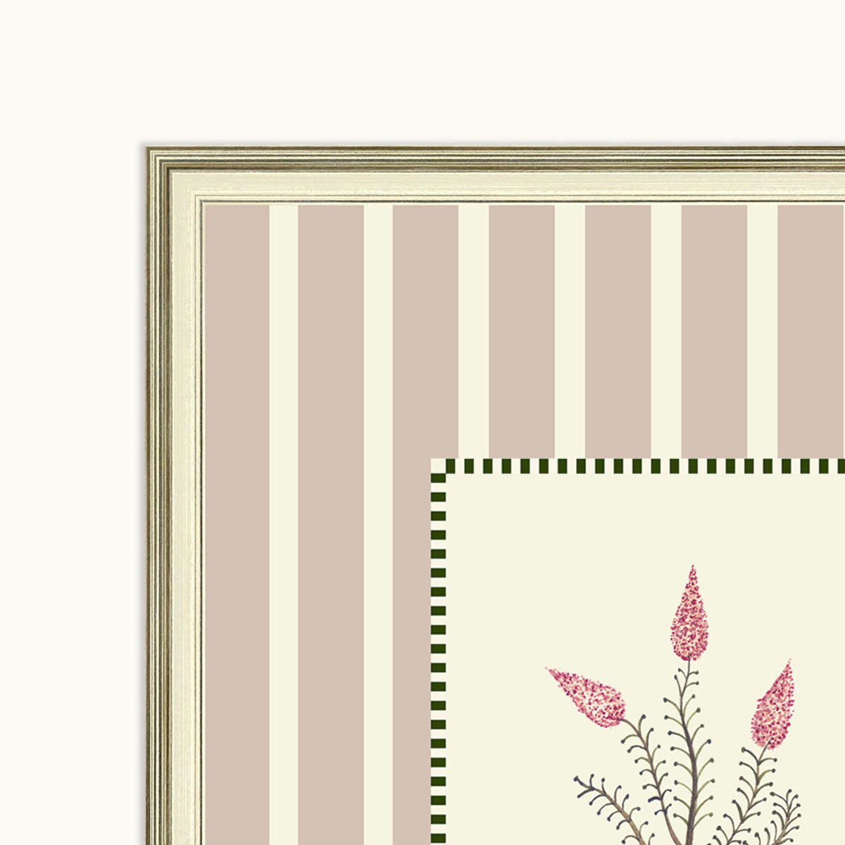 Close-up of a framed art featuring vertical taupe and cream stripes, a green checkered border, and pink floral illustrations.