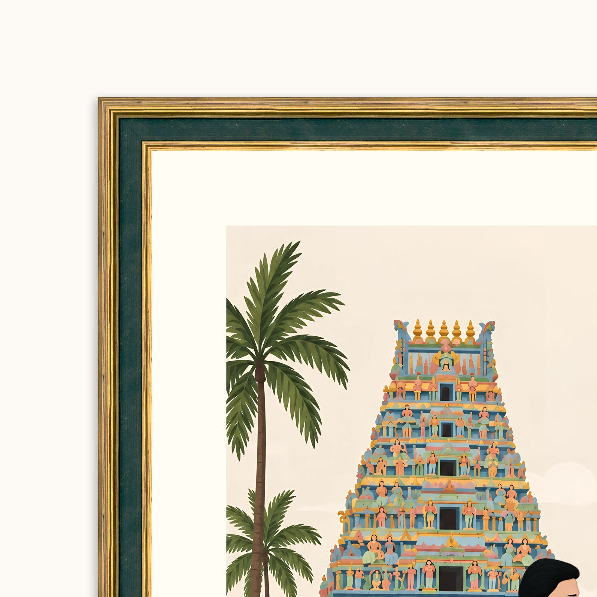 A framed art featuring a stylized illustration of a South Indian temple tower and palm trees, shown in a close-up corner view with a gold frame and dark green matting.