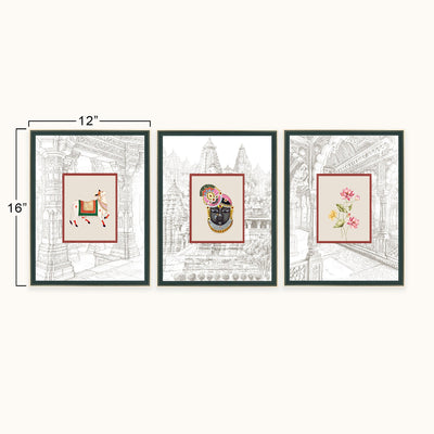 Three framed art displayed side by side on a light beige background, with dimension lines indicating 12 inches wide by 16 inches tall. The prints feature traditional Indian-style illustrations: a deer, a black-and-gold mask, and pink flowers, set against architectural line drawings.