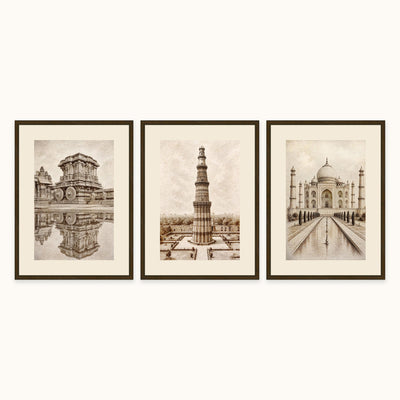Three framed sepia-toned architectural frame art hang side by side on a light wall. The left print shows a Humpi Temple with reflection scene, the center shows a tall Kutub Minar with a central column, and the right shows a Tajmahal with a long reflecting pool.