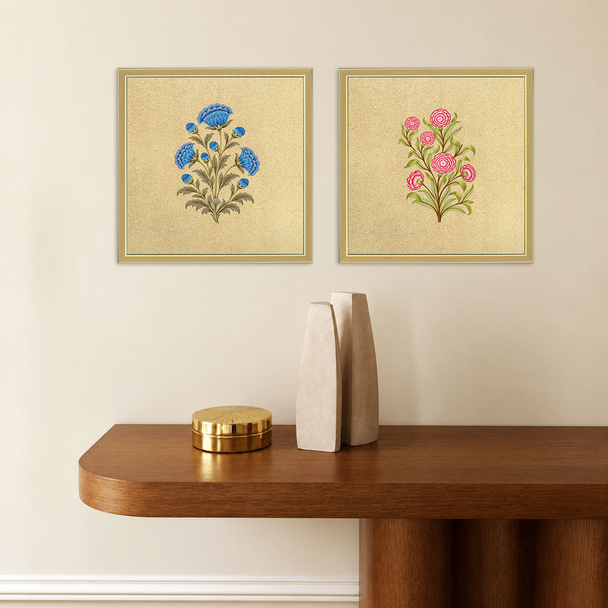 Royal Floral Duo wall art set displayed above a wooden console, featuring blue and pink floral motifs in golden frames