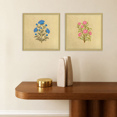 Royal Floral Duo wall art set displayed above a wooden console, featuring blue and pink floral motifs in golden frames