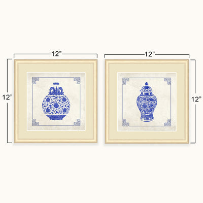 Two framed blue-and-white porcelain vase art shown side by side with dimension lines indicating 12 by 12 inch size on a light neutral background.