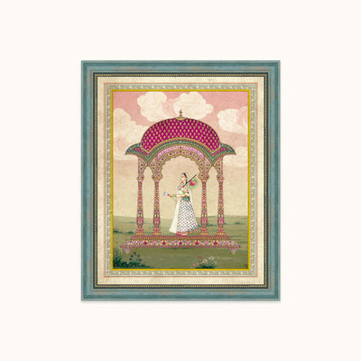A framed art featuring a traditional Indian style painting of a woman dancing under a pink and green pavilion, set against a light cream background.